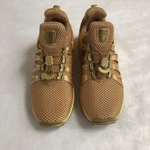 nike shox gravity women's gold